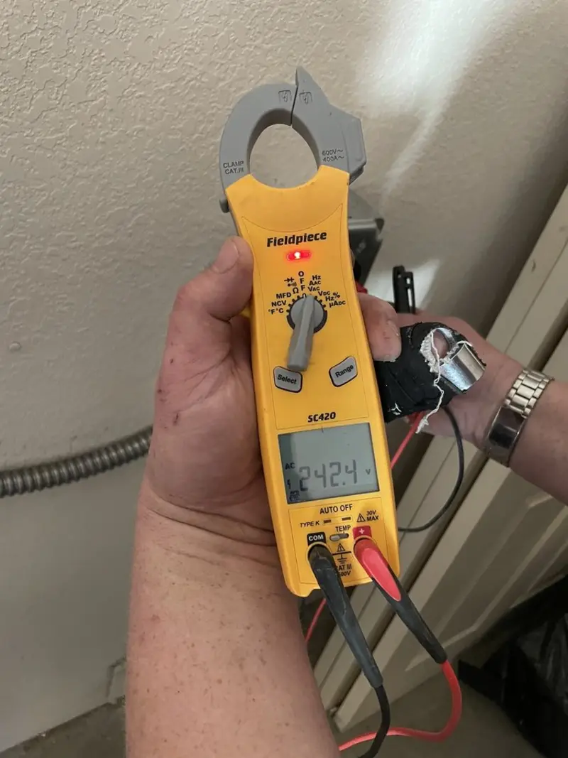 Voltage testing with clamp meter during Electrical Installation Services in Huntington